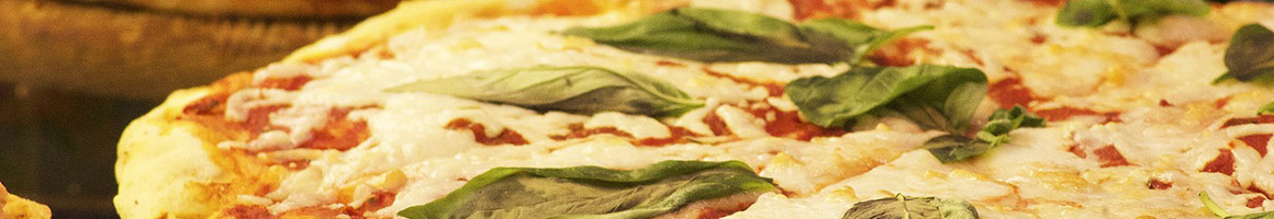 Eating Italian Pizza at Vinny’s Italian Kitchen restaurant in Middlefield, OH.
